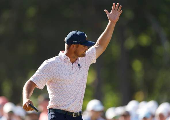 Bryson DeChambeau waves to spectators on the ninth green during the third round of the 124th U.S. Open golf championship at Pinehurst Resort & Country Club in Pinehurst, N.C. on Saturday, June 15, 2024.  NCP20240615339 JOHNxANGELILLO