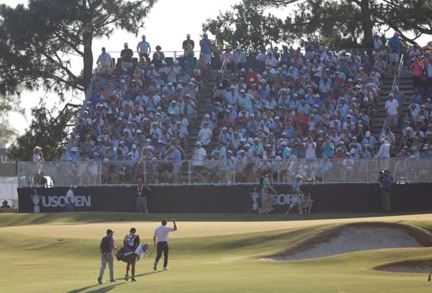 Bryson DeChambeau reacts to fans as he walks up to the thirteenth green during the third round of the 124th U.S. Open golf championship at Pinehurst Resort & Country Club in Pinehurst, N.C. on Saturday, June 15, 2024.  NCP20240615354 JOHNxANGELILLO