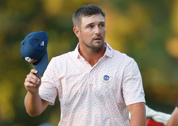 Bryson DeChambeau acknowledges his fans as he walks up to the seventeenth green during the third round of the 124th U.S. Open golf championship at Pinehurst Resort & Country Club in Pinehurst, N.C. on Saturday, June 15, 2024.  NCP20240615370 JOHNxANGELILLO