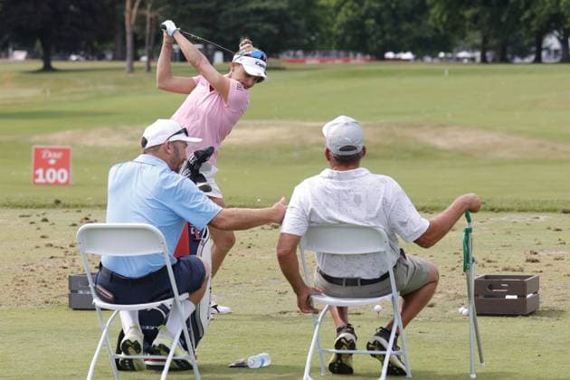 GRAND RAPIDS, MI - JUNE 15: LPGA, Golf Damen golfer Lexi Thompson hits balls on the practice range after finishing her 3rd round while her caddie and father watch during the LPGA Meijer LPGA Classic for Simply Give on June 15th, 2024, at Blythefield Country Club in Grand Rapids, Michigan. (Photo by Brian Spurlock Icon Sportswire) GOLF: JUN 15 LPGA Meijer LPGA Classic for Simply Give EDITORIAL USE ONLY Icon24061557