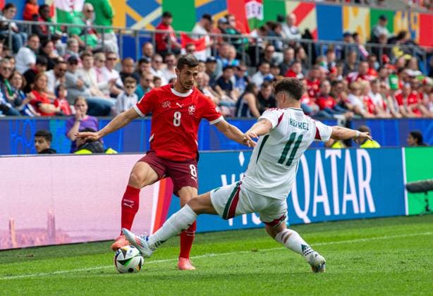 Football, Men, Season 2023 24, Euro 2024 Group A 1 Matchday in Cologne, Hungary Switzerland, f l Remo Freuler Switzerland , Milos Kerkez Hungary , 15 06 2024, Copyright: xSebastianxRäppold MatthiasxKochx