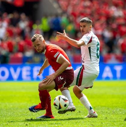 Football, Men, Season 2023 24, Euro 2024 Group A 1 Matchday in Cologne, Hungary Switzerland, f l Silvan Widmer Switzerland , Adam Nagy Hungary , 15 06 2024, Copyright: xSebastianxRäppold MatthiasxKochx