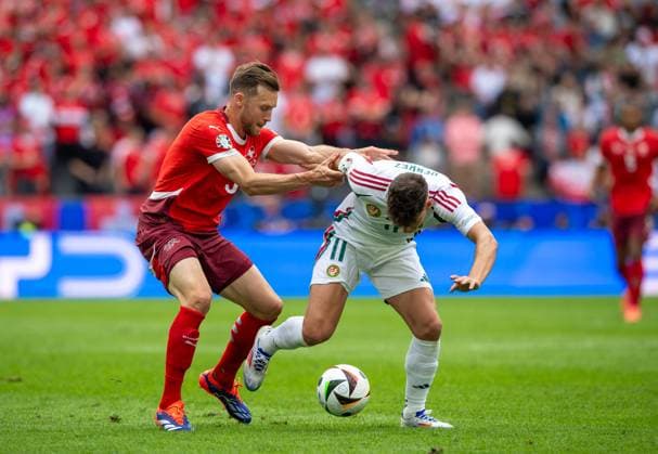 Football, Men, Season 2023 24, Euro 2024 Group A 1 Matchday in Cologne, Hungary Switzerland, f l Silvan Widmer Switzerland , Milos Kerkez Hungary , 15 06 2024, Copyright: xSebastianxRäppold MatthiasxKochx