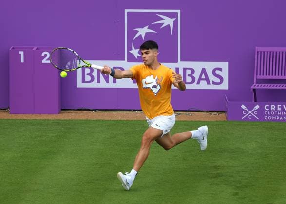 16th June 2024; Cinch Championships, Queens Club, West Kensington, London, England: Cinch Championships Queens Club, Qualifying Day 2; Defending Cinch Champion Carlos Alcaraz (ESP) with a forehand shot to Francisco Cerundolo (ARG) during his practice session on Centre Court  ActionPlus12655108 JohnxPatrickxFletcher