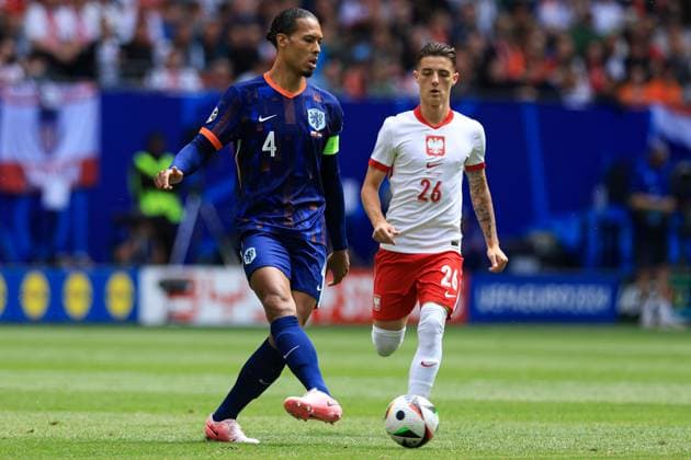 Virgil van Dijk of The Netherlands under pressure from Kacper Urbanski of Poland Poland v Netherlands, UEFA European Championship, EM, Europameisterschaft 2024, Group D, Football, Volksparkstadion, Hamburg, Germany, 16 Jun 2024 EDITORIAL USE ONLY No use with unauthorised audio, video, data, fixture lists, club league logos or live services. Online in-match use limited to 120 images, no video emulation. No use in betting, games or single club league player publications. Copyright: xMattxWest Shutterstockx 14539367bc