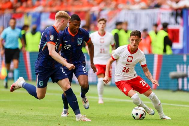 Jerdy Schouten Netherlands , Denzel Dumfries Netherlands and Kacper Urbanski Poland fight for the ball, UEFA EURO 2024 Group D, Poland vs Netherlands, Volksparkstadion Hamburg, 16 06 2024, Hamburg, Germany