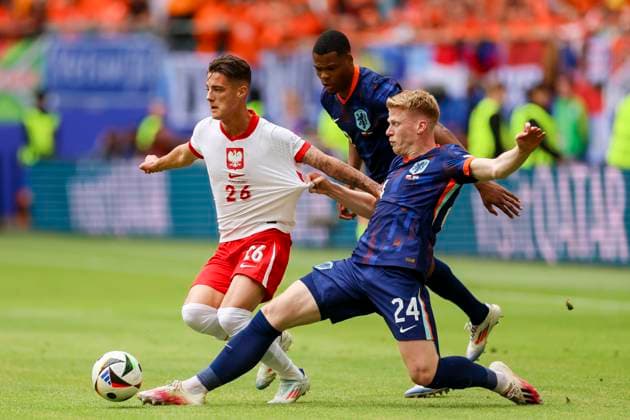 Kacper Urbanski Poland , Denzel Dumfries Netherlands and Jerdy Schouten Netherlands fight for the ball, UEFA EURO 2024 Group D, Poland vs Netherlands, Volksparkstadion Hamburg, 16 06 2024, Hamburg, Germany
