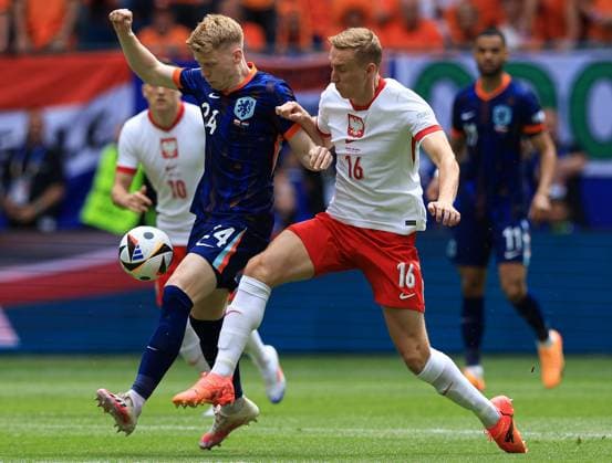 Jerdy Schouten of The Netherlands battles with Adam Buksa of Poland Poland v Netherlands, UEFA European Championship, EM, Europameisterschaft 2024, Group D, Football, Volksparkstadion, Hamburg, Germany, 16 Jun 2024 EDITORIAL USE ONLY No use with unauthorised audio, video, data, fixture lists, club league logos or live services. Online in-match use limited to 120 images, no video emulation. No use in betting, games or single club league player publications.  Copyright: xMattxWest Shutterstockx 14539367bx