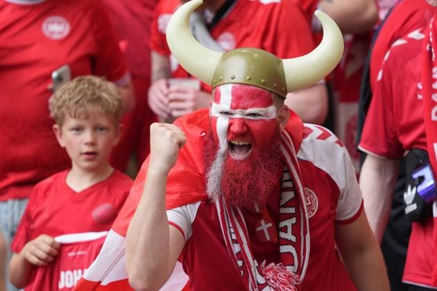 Danish fans with Viking helmets and the national colors on their faces are looking forward to the match Stuttgart 16 06 2024 Denmark vs Slovenia, EURO2024 M6, Group C, EM Arena Stuttgart