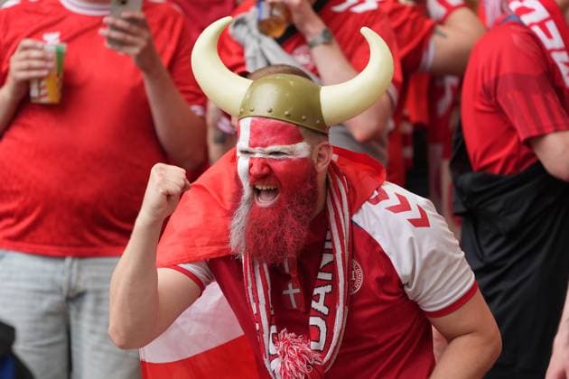 Danish fans with Viking helmets and the national colors on their faces are looking forward to the match Stuttgart 16 06 2024 Denmark vs Slovenia, EURO2024 M6, Group C, EM Arena Stuttgart