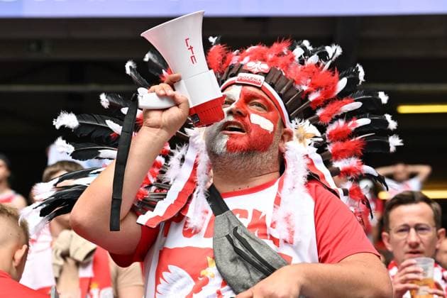 (240616) -- HAMBURG, June 16, 2024 -- A fan of Poland is seen before the UEFA EURO, EM, Europameisterschaft,Fussball 2024 Group D match between Poland and the Netherlands in Hamburg, Germany on June 16, 2024. ) (SP)GERMANY-HAMBURG-FOOTBALL-EURO 2024-POLAND VS THE NETHERLANDS RenxPengfei 