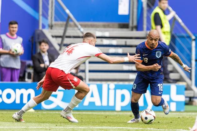 16th June 2024; Volksparkstadion, Hamburg, Germany; Euro 2024 Group D Football, Poland versus Netherlands; Jakub Kiwior (POL) is beaten by the turn from Donyell Malen (NED)  ActionPlus12655256 TomaszxJastrzebowski