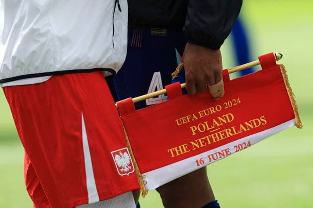 Virgil van Dijk of The Netherlands holds The Poland pennant as both teams shake hands prior to kick-off Poland v Netherlands, UEFA European Championship, EM, Europameisterschaft 2024, Group D, Football, Volksparkstadion, Hamburg, Germany, 16 Jun 2024 EDITORIAL USE ONLY No use with unauthorised audio, video, data, fixture lists, club league logos or live services. Online in-match use limited to 120 images, no video emulation. No use in betting, games or single club league player publications. Copyright: xMattxWest Shutterstockx 14539367hk