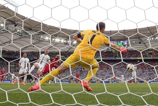 Christian Eriksen of Denmark scores past Jan Oblak of Slovenia to make it 0-1 Slovenia v Denmark, UEFA European Championship, EM, Europameisterschaft 2024, Group C, Football, Stuttgart Arena, Stuttgart, Germany, 16 Jun 2024 EDITORIAL USE ONLY No use with unauthorised audio, video, data, fixture lists, club league logos or live services. Online in-match use limited to 120 images, no video emulation. No use in betting, games or single club league player publications. Copyright: xMichaelxZemanek Shutterstockx 14539399cu