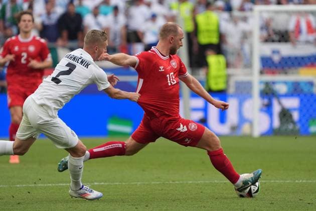 Zan Karnicnik Slovenia, Slovenia, 02 can hold Christian Eriksen Denmark, Denmark, 10 only by holding on Stuttgart 16 06 2024 Denmark vs Slovenia, EURO2024 M6, Group C, EM Arena Stuttgart