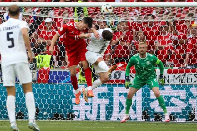 Christian Noergaard Denmark, 15 and Benjamin Verbic Slovenia, 07 in a header duel , Football, UEFA , European Championship, Group C 2024, Slovenia vs Denmark, 16 06 2024, Stuttgart Arena, Stuttgart, Germany Stuttgart Stuttgart Arena Baden Wuerttemberg Germany Copyright: xGrantxHubbsx
