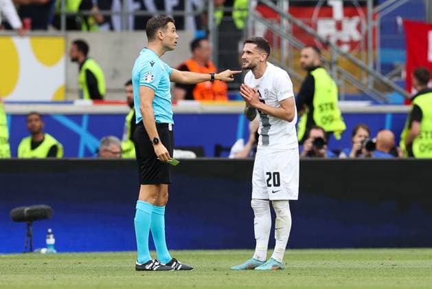 Soccer UEFA EURO 2024 Group Stage 1 Matchday Slovenia Denmark on 16 06 2024 at Stuttgart Arena in Stuttgart Referee Sandro Schärer Switzerland , left Petar Stojanovic Slovenia , right xMSx