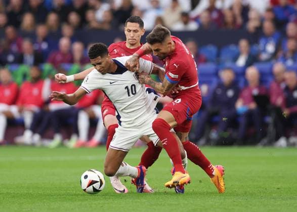 Gelsenkirchen, Germany, 16th June 2024. Jude Bellingham of England tackled by Nemanja Gudelj of Serbia during the UEFA European Championships match at Arena Aufschalke, Gelsenkirchen. Picture credit should read: David Klein Sportimage EDITORIAL USE ONLY. No use with unauthorised audio, video, data, fixture lists, club league logos or live services. Online in-match use limited to 120 images, no video emulation. No use in betting, games or single club league player publications. SPI-3196-0023
