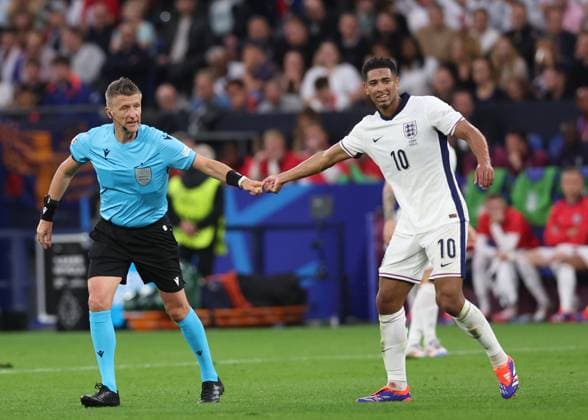 Gelsenkirchen, Germany, 16th June 2024. Referee Daniele Orsato reacts with Jude Bellingham of England during the UEFA European Championships match at Arena Aufschalke, Gelsenkirchen. Picture credit should read: David Klein Sportimage EDITORIAL USE ONLY. No use with unauthorised audio, video, data, fixture lists, club league logos or live services. Online in-match use limited to 120 images, no video emulation. No use in betting, games or single club league player publications. SPI-3196-0044