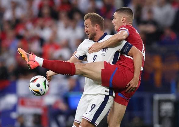 Gelsenkirchen, Germany, 16th June 2024. Harry Kane of England tussles with Nikola Milenkovic of Serbia during the UEFA European Championships match at Arena Aufschalke, Gelsenkirchen. Picture credit should read: David Klein Sportimage EDITORIAL USE ONLY. No use with unauthorised audio, video, data, fixture lists, club league logos or live services. Online in-match use limited to 120 images, no video emulation. No use in betting, games or single club league player publications. SPI-3196-0042
