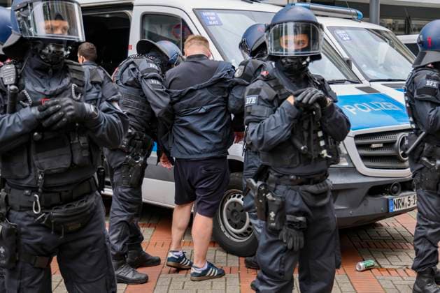 16 06 2024 , Gelsenkirchen, Euro 2024, Fans in Gelsenkirchen at England v Serbia match Police officers arrest English fans who were previously involved in an attack on a Serbian restaurant