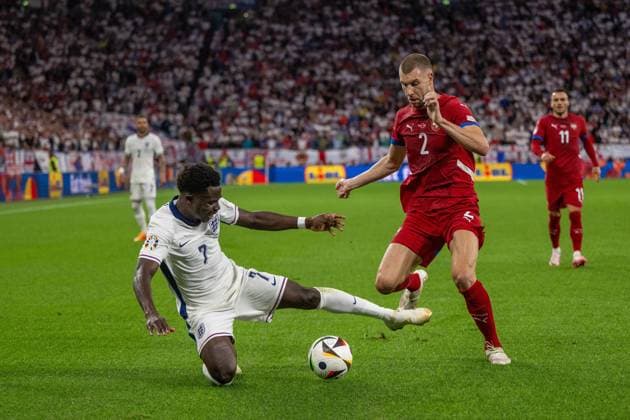 GER, EURO 2024, Group C, Serbia SRB vs England GBR 16 06 2024, Arena AufSchalke, Gelsenkirchen, GER, EURO 2024, Group C, Serbia SRB vs England GBR In the picture Bukayo Saka England GBR, 07 is brought down by Strahinja Pavlovic Serbia SRB, 02 in a duel, duel, dynamics, action, action scene gestures, facial expressions, emotions nordphotoxGmbHxx xDenkinger nph00015