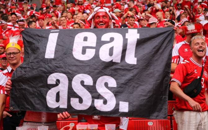 BAU 16 06 2024 Stuttgart European Football Championship 2024 Slovenia vs Denmark, Danish fan with poster I eat ass