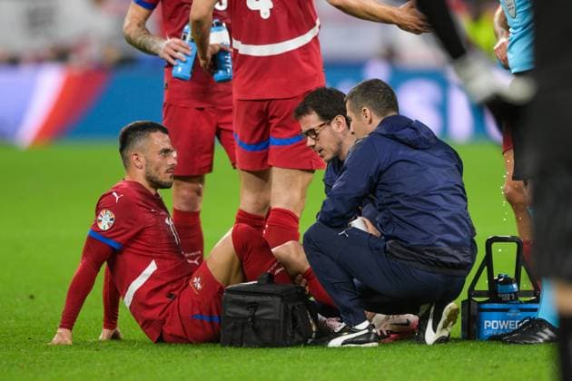 Soccer, UEFA EURO 2024, 20240616, Serbia England In the picture Filip KOSTIC Serbia, 11 battered on the ground being treated Gelsenkirchen Arena auf Schalke North Rhine-Westphalia Germany Copyright: Passion2Press MarkusxFischerx