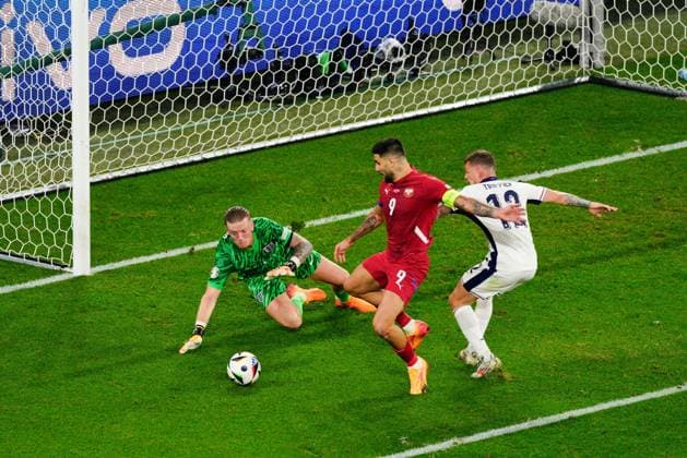 Jordan Pickford of England challenges Aleksandar Mitrovic of Serbia Serbia v England, UEFA European Championship, EM, Europameisterschaft 2024, Group C, Football, Arena Aufschalke, Gelsenkirchen, Germany, 16 Jun 2024 EDITORIAL USE ONLY No use with unauthorised audio, video, data, fixture lists, club league logos or live services. Online in-match use limited to 120 images, no video emulation. No use in betting, games or single club league player publications. Copyright: xDavexShopland Shutterstockx 14539403bg