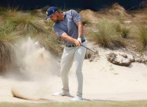 Bryson DeChambeau hits out of a bunker on the fifth hole during the final round of the 124th U.S. Open golf championship at Pinehurst Resort & Country Club in Pinehurst, N.C. on Sunday, June 16, 2024.  NCP20240616302 JOHNxANGELILLO