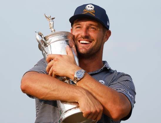 Bryson DeChambeau holds his trophy after winning the 124th U.S. Open golf championship at Pinehurst Resort & Country Club in Pinehurst, N.C. on Sunday, June 16, 2024. DeChambeau won with a six-under-par score of 274.  NCP20240616364 JOHNxANGELILLO