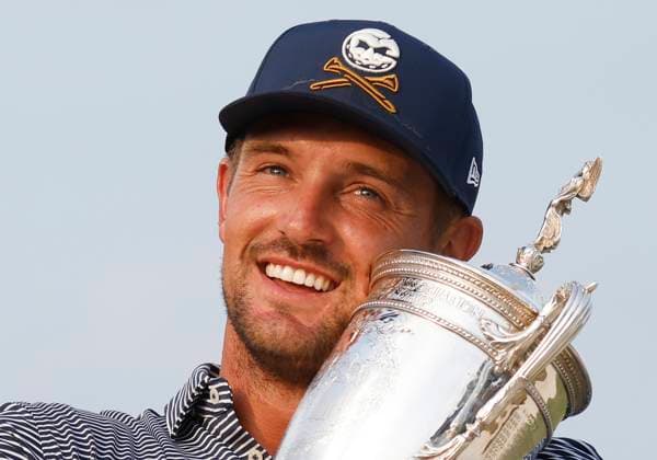 Bryson DeChambeau holds his trophy after winning the 124th U.S. Open golf championship at Pinehurst Resort & Country Club in Pinehurst, N.C. on Sunday, June 16, 2024. DeChambeau won with a six-under-par score of 274.  NCP20240616365 JOHNxANGELILLO