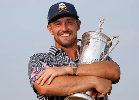 Bryson DeChambeau holds his trophy after winning the 124th U.S. Open golf championship at Pinehurst Resort & Country Club in Pinehurst, N.C. on Sunday, June 16, 2024. DeChambeau won with a six-under-par score of 274.  NCP20240616366 JOHNxANGELILLO