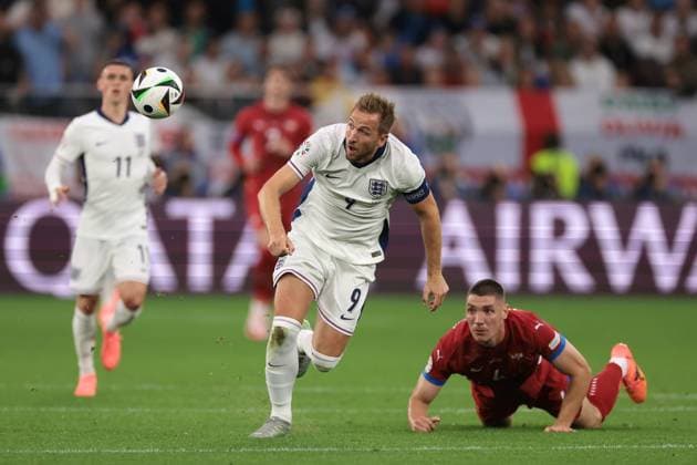 Gelsenkirchen, Germany, 16th June 2024. Harry Kane of England clashes with Nikola Milenkovic of Serbia during the UEFA European Championships match at Arena Aufschalke, Gelsenkirchen. Picture credit should read: Jonathan Moscrop Sportimage EDITORIAL USE ONLY. No use with unauthorised audio, video, data, fixture lists, club league logos or live services. Online in-match use limited to 120 images, no video emulation. No use in betting, games or single club league player publications. SPI-3183-0047