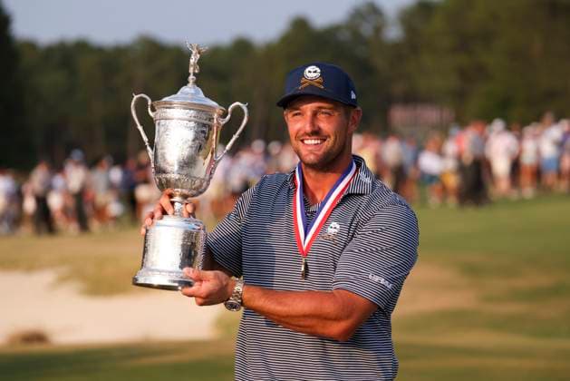 Bryson DeChambeau of the United States poses with the championship trophy after winning the 124th U.S. Open golf championship at Pinehurst Resort & Country Club in Pinehurst, N.C. on Sunday, June 16, 2024.  NCP20240616813 VeaseyxConway