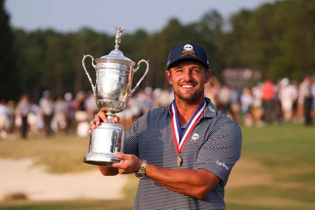 Bryson DeChambeau of the United States poses with the championship trophy after winning the 124th U.S. Open golf championship at Pinehurst Resort & Country Club in Pinehurst, N.C. on Sunday, June 16, 2024.  NCP20240616814 VeaseyxConway