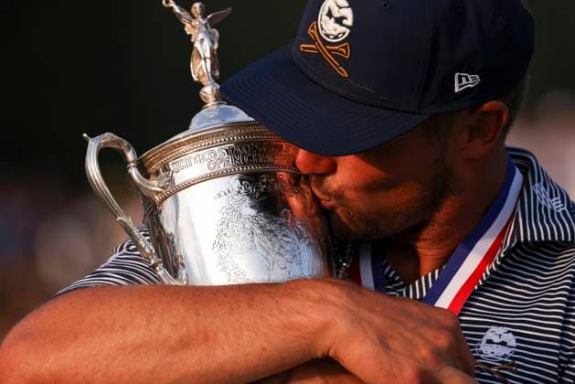Bryson DeChambeau of the United States kisses the championship trophy after winning the 124th U.S. Open golf championship at Pinehurst Resort & Country Club in Pinehurst, N.C. on Sunday, June 16, 2024.  NCP20240616822 VeaseyxConway