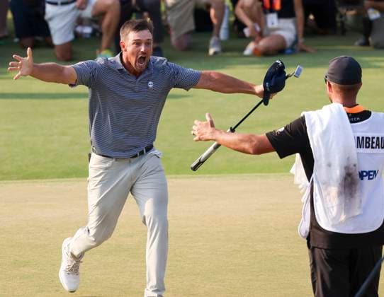 Bryson DeChambeau of the United States runs toward his caddie after winning the 124th US Open golf championship at Pinehurst Resort & Country Club in Pinehurst, N.C. on Sunday, June 16, 2024.  NCP20240616807r VeaseyxConway