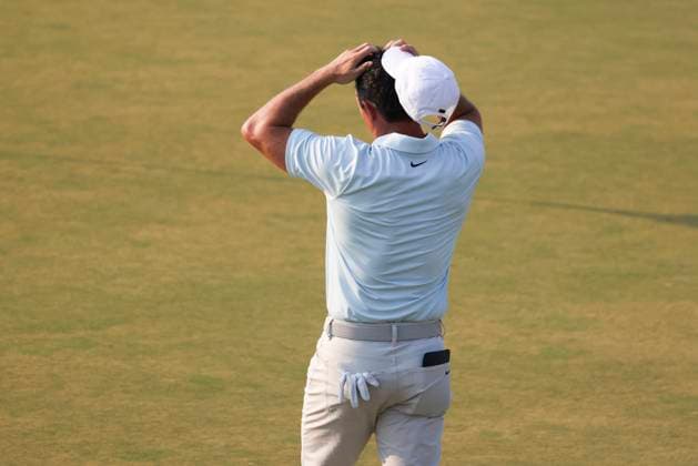 Rory McIlroy of Northern Ireland holds his hands to his head after finishing the 18th hole during the final round of the 124th US Open golf championship at Pinehurst Resort & Country Club in Pinehurst, N.C. on Sunday, June 16, 2024.  NCP20240616833 VeaseyxConway