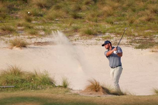 Bryson DeChambeau of the United States swings from a bunker near the 18th green during the final round of the 124th US Open golf championship at Pinehurst Resort & Country Club in Pinehurst, N.C. on Sunday, June 16, 2024.  NCP20240616836 VeaseyxConway