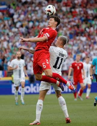 (240617) -- STUTTGART, June 17, 2024 -- Andreas Christensen (top) of Denmark vies for a header against Benjamin Sesko of Slovenia during the UEFA EURO, EM, Europameisterschaft,Fussball 2024 Group C match between Denmark and Slovenia in Stuttgart, Germany on June 16, 2024. (Photo by Xinhua) (SP)GERMANY-STUTTGART-FOOTBALL-EURO 2024-DENMARK VS SLOVENIA PhilippexRuiz 