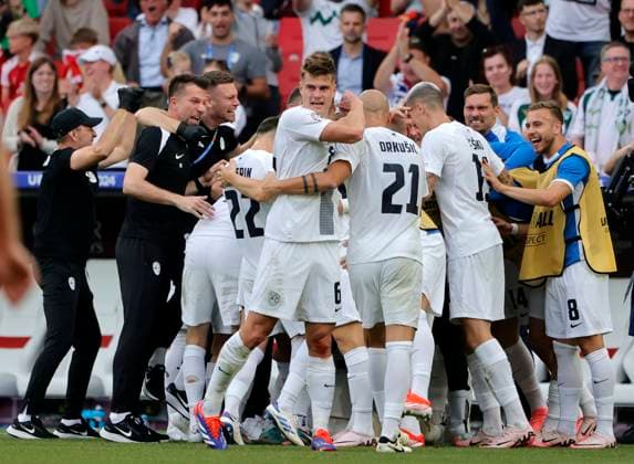 (240617) -- STUTTGART, June 17, 2024 -- Players of Slovenia celebrate scoring during the UEFA EURO, EM, Europameisterschaft,Fussball 2024 Group C match between Denmark and Slovenia in Stuttgart, Germany on June 16, 2024. (Photo by Xinhua) (SP)GERMANY-STUTTGART-FOOTBALL-EURO 2024-DENMARK VS SLOVENIA PhilippexRuiz 