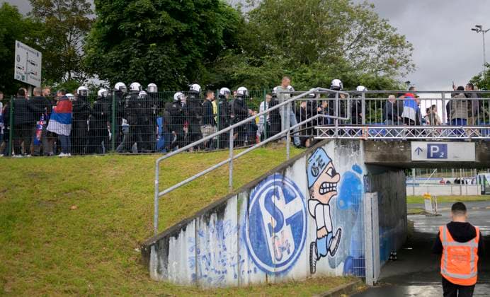 Feature, police secure the way of SRB fans to the stadium, including an S04 logo, FC Schalke 04, preliminary round 1 match day, group C, match M05, Serbia SRB England ENG , on 16 06 2024 in Gelsenkirchen Germany European Football Championship 2024 from 14 06 14 07 2024 in Germany Â