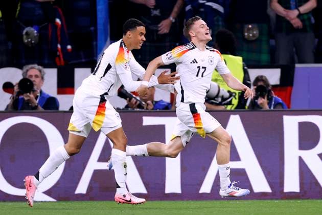 WIRTZ Florian Team Germany cheers after his goal for 1 0 with MUSIALA Jamal UEFA Football EURO 2024 in Germany Opening match Germany Scotland on 14 06 2024 in Munich DFL REGULATIONS PROHIBIT ANY USE OF PHOTOGRAPHS as IMAGE SEQUENCES and or QUASI VIDEO Copyright: xLacixPerenyix