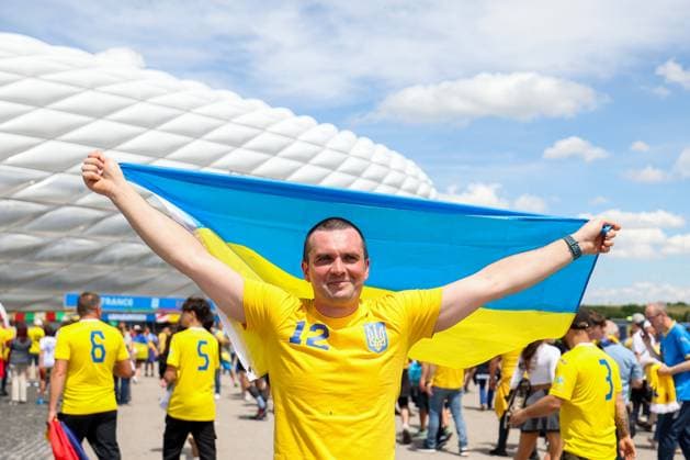 Soccer UEFA EURO 2024 group stage 1 matchday Romania Ukraine on 17 06 2024 at Munich Football Arena in Munich fan Ukraine with flag flag in front of the arena xMSx