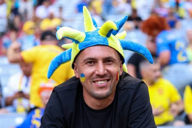 Soccer UEFA EURO 2024 group stage 1 matchday Romania Ukraine on 17 06 2024 at Munich Football Arena in Munich fan with Ukraine and Romania flag make-up on face xMSx