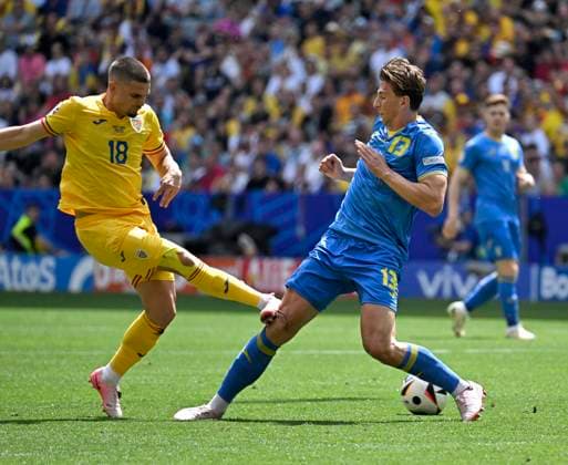 17 06 2024, Football UEFA EURO 2024, Preliminary Round, Match 10, Romania Ukraine, at the Fußball Arena München v l Razvan Marin Romania v Ilya Zabarnyi Ukraine