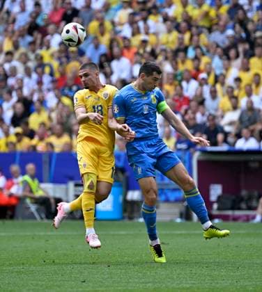 17 06 2024, Football UEFA EURO 2024, Preliminary Round, Match 10, Romania Ukraine, at the Fußball Arena München v l Razvan Marin Romania v Taras Stepanenko Ukraine