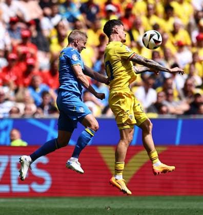 Oleksandr Zinchenko of Ukraine, Dennis Man of Romania Romania v Ukraine, UEFA European Championship, EM, Europameisterschaft 2024, Group E, Football, Munich Football Arena, Munich, Germany, 17 Jun 2024 EDITORIAL USE ONLY No use with unauthorised audio, video, data, fixture lists, club league logos or live services. Online in-match use limited to 120 images, no video emulation. No use in betting, games or single club league player publications.  Copyright: xMichaelxZemanek Shutterstockx 14539636r