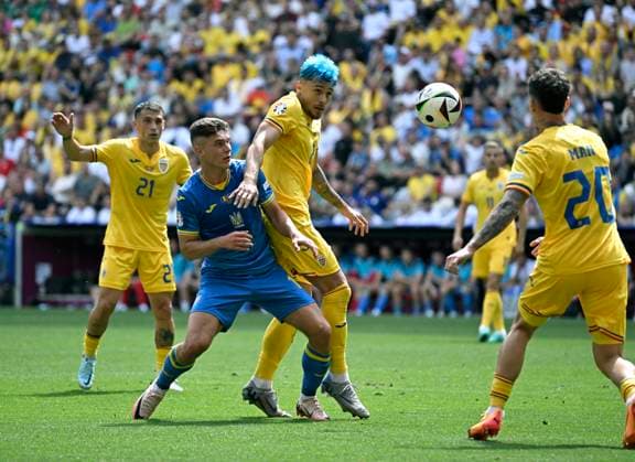 17 06 2024, Football UEFA EURO 2024, Preliminary Round, Match 10, Romania Ukraine, in the Football Arena Munich v l Georgiy Sudakov Ukraine v Andrei Ratiu Romania